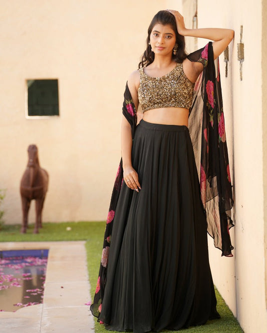 Black lehenga with sequins blouse and printed cape